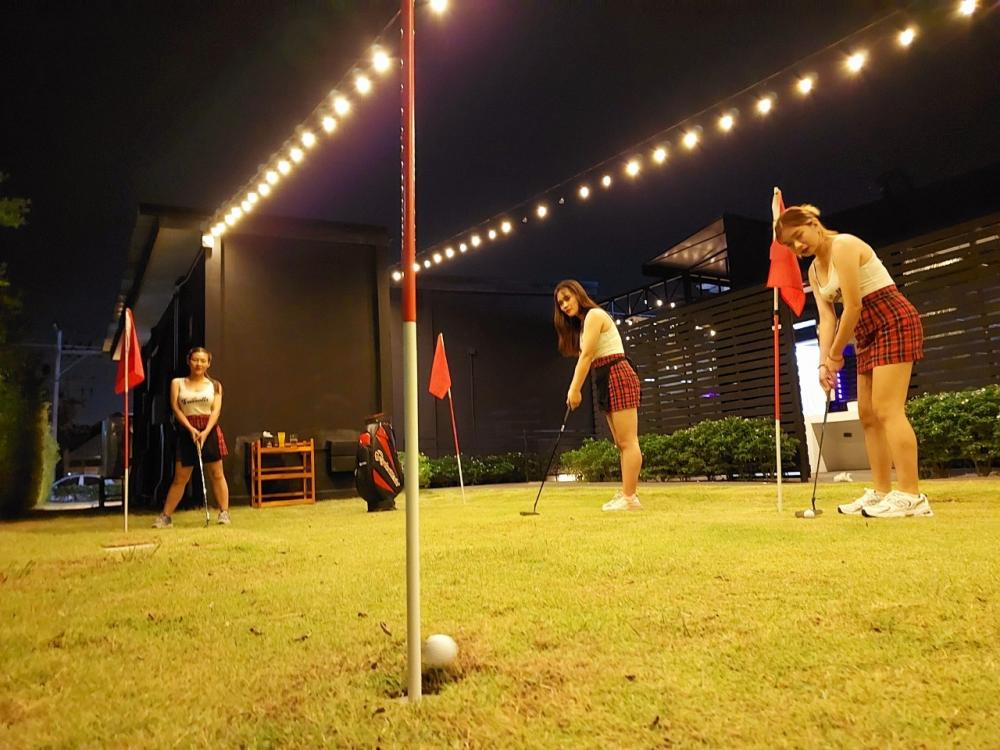 Sip local beers surrounded by lush greenery