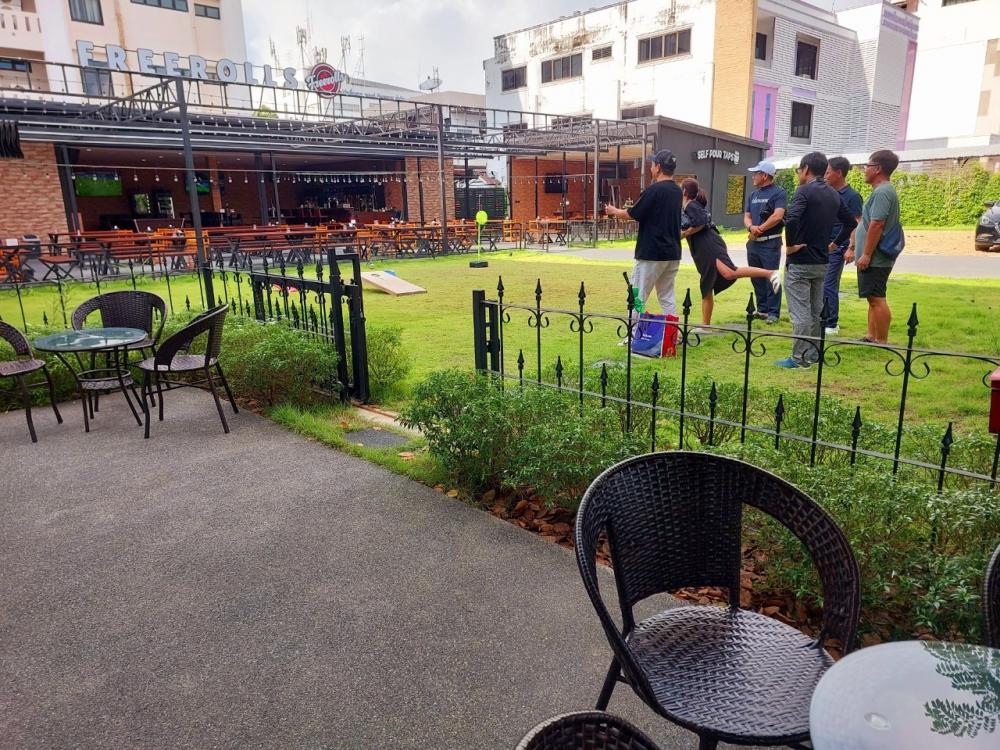 Sip local beers surrounded by lush greenery